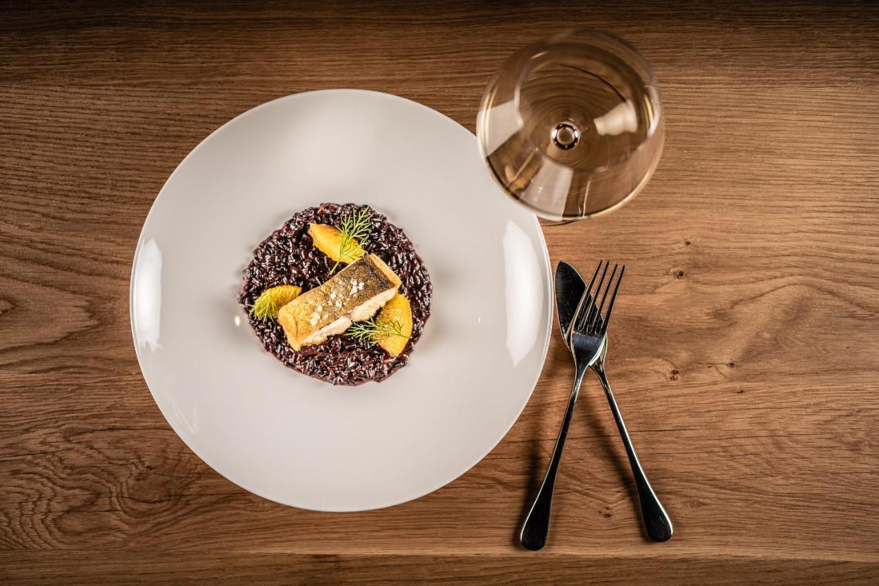 My Arbor - Dolomites Hotel Bressanone Exterior photo A plate of black rice risotto