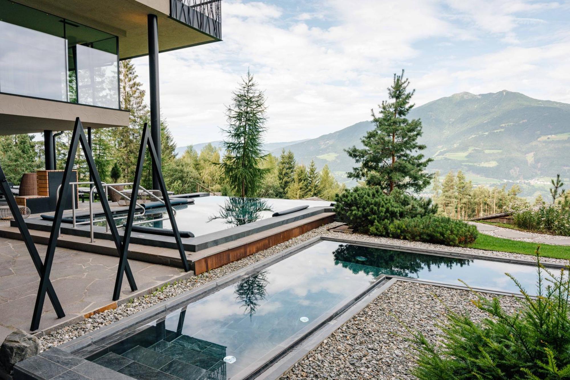 My Arbor - Dolomites Hotel Bressanone Exterior photo A private swimming pool in the Alps
